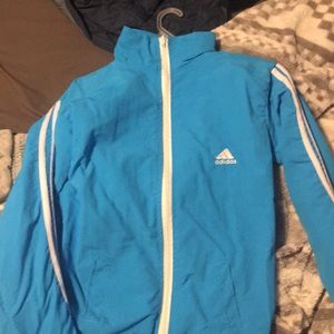 Blue Adidas windbreaker jacket.